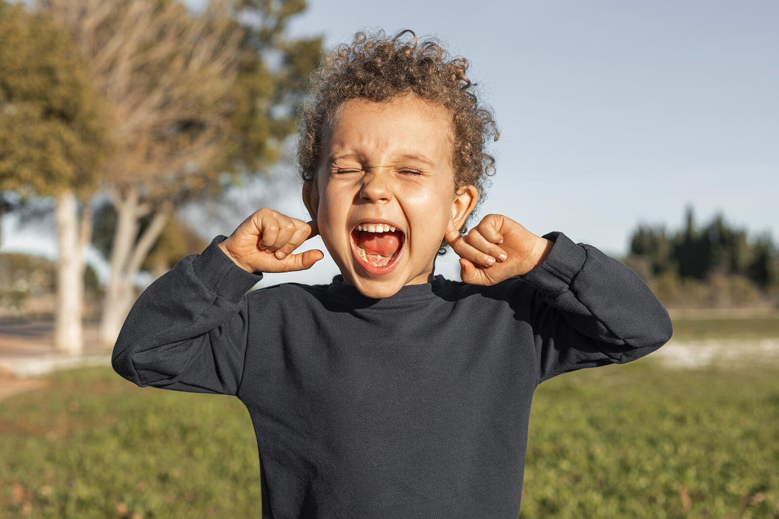 little-boy-outdoors-covering-his-ears.jpg [1.83 MB]