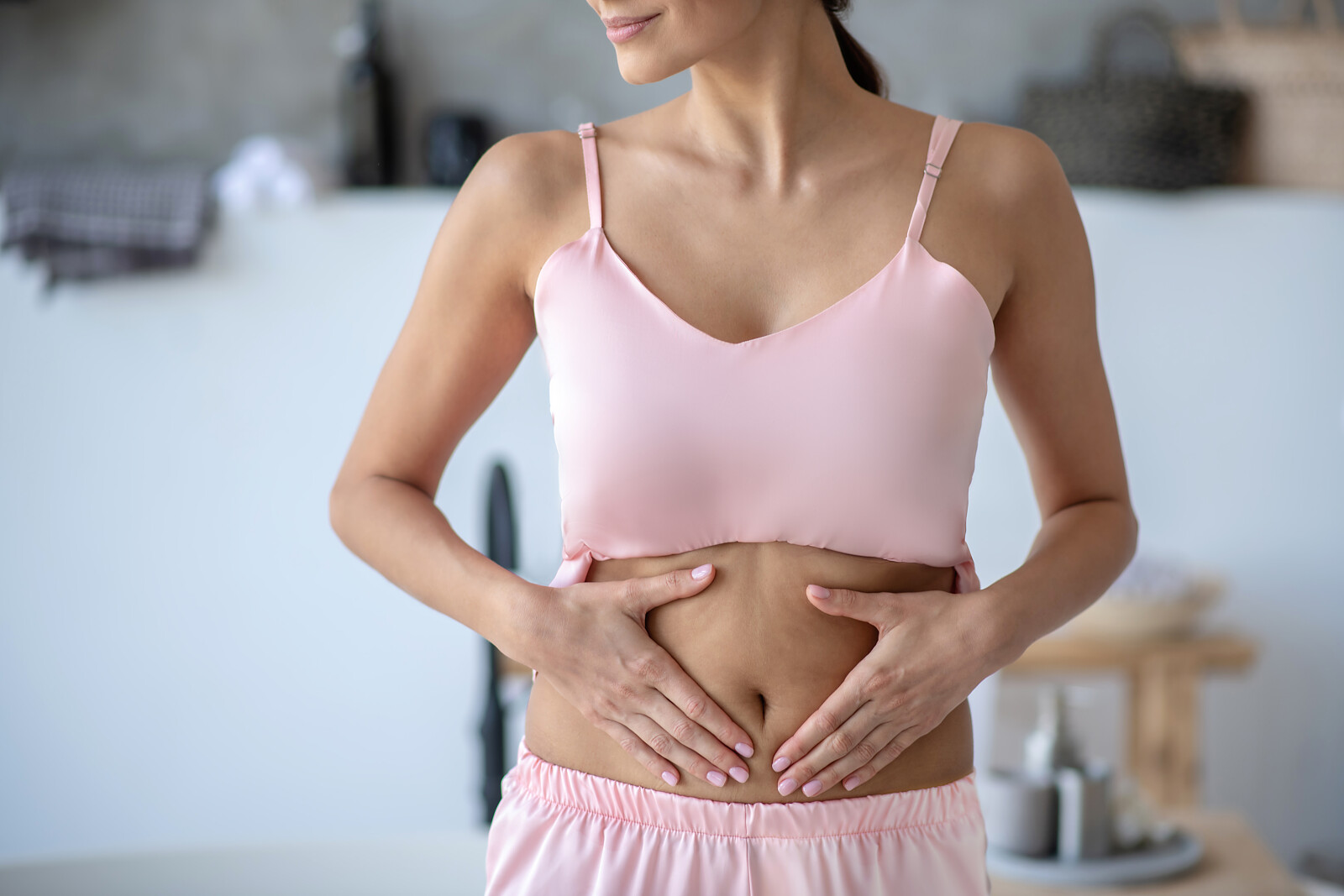 young-woman-wearing-pajama-touching-her-belly.jpg [6.67 MB]